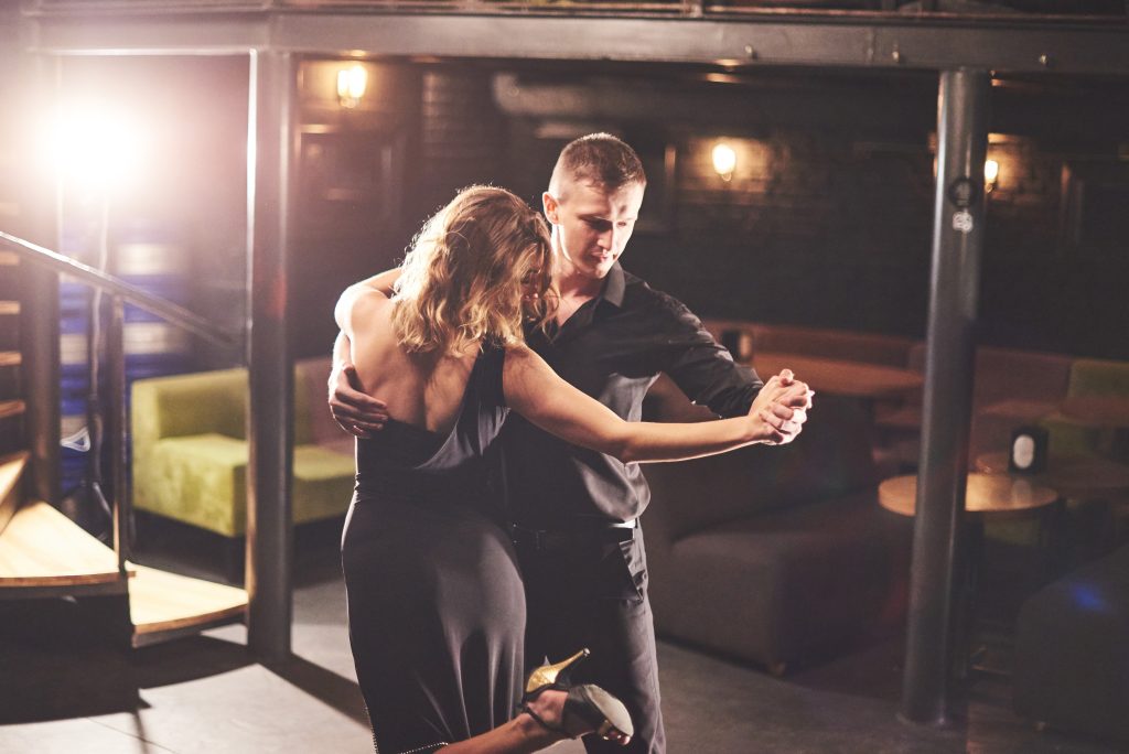 La Fiesta Dance Factory Fun Dance Classes in Sydney NSW Skillful Dancers Performing In The Dark Room Under The Light
