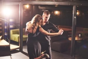 La Fiesta Dance Factory Fun Dance Classes in Sydney NSW Skillful Dancers Performing In The Dark Room Under The Light